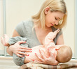 Mother breast feeding her infant
