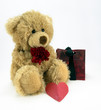 Photo: Cuddly ted with red flower and heart. Cuddly ted with red flower and heart.