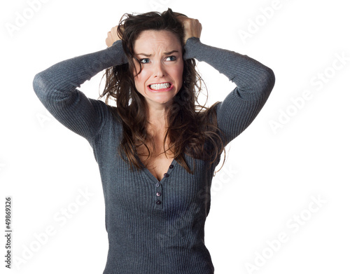 Photo: Frustrated woman pullinh ger hair Frustrated woman pullinh ger hair