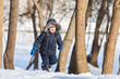 Cute boy in the winter park