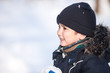 Cute boy playing with snow
