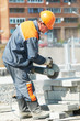 builder at cutting curb work