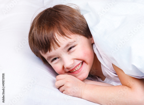 Photo: Laughing boy in bed Laughing boy in bed