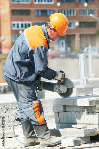 Photo: builder at cutting curb work builder at cutting curb work