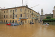 cars in the streets and roads submerged by the mud of the flood