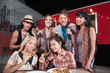 Happy Patrons Holding Pizza