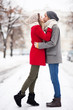 Young couple kissing on winter day