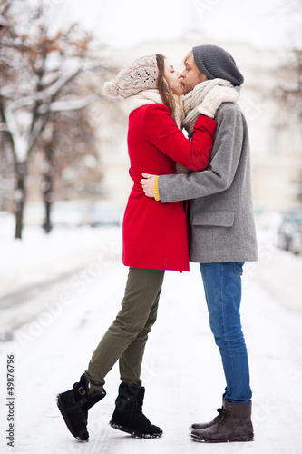 Photo: Young couple kissing on winter day Young couple kissing on winter day