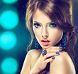 Model with blue make-up and manicure