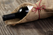 Red wine bottle wooden table