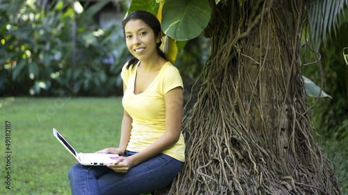 Photo: Young Woman using a laptop Young Woman using a laptop