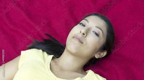 Photo: Woman lying on a blanket Woman lying on a blanket