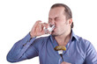 image of a man with a glass of vodka and a cucumber
