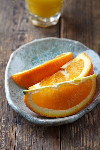 Photo: Fresh oranges on a plate Fresh oranges on a plate