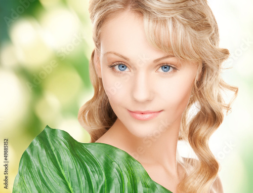 Photo: woman with green leaf woman with green leaf