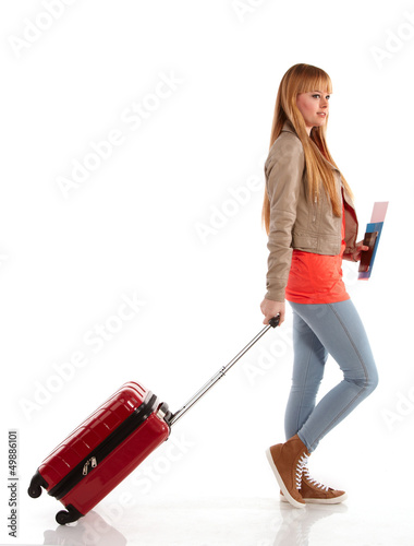 Photo: young girl with suitcase on white young girl with suitcase on white