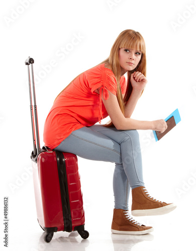 Photo: young girl with suitcase on white young girl with suitcase on white