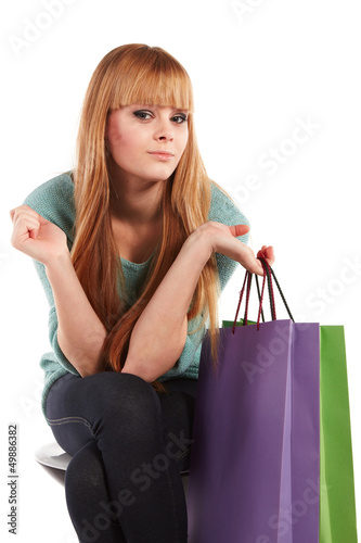 Photo: girl with shopping bags , isolated on white background girl with shopping bags , isolated on white background