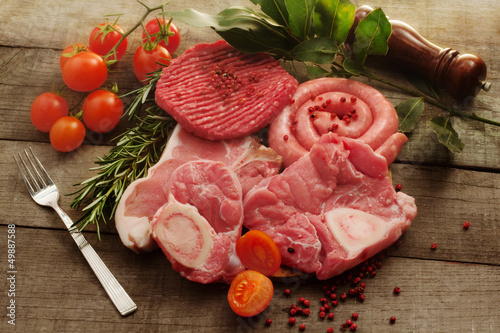 Photo: raw meat selection over rough wood raw meat selection over rough wood
