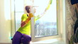 Women cleaning a window