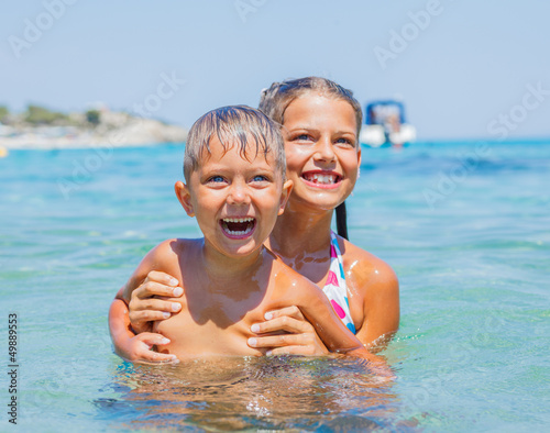 Photo: Kids playing in the sea Kids playing in the sea