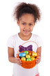African Asian girl holding chocolate ester egg