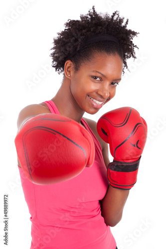 Photo: Portrait of a fitness woman wearing boxing gloves Portrait of a fitness woman wearing boxing gloves
