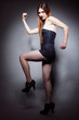 Woman long hair make-up shows her muscles