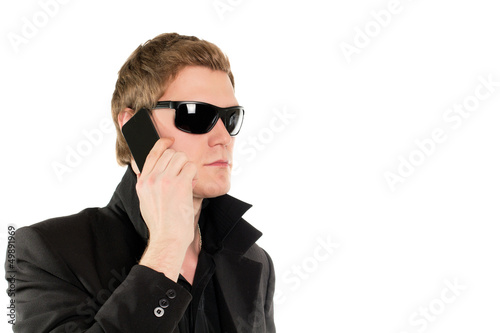 Photo: Man in black with a phone Man in black with a phone