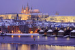Night colorful snowy Prague gothic Castle with Charles Bridge Night colorful snowy Prague gothic Castle with Charles Bridge