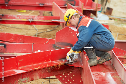 Photo: builder worker at construction site builder worker at construction site
