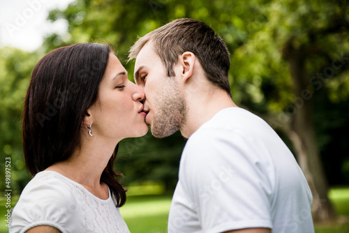 Photo: Young kissing couple in love Young kissing couple in love