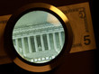 Foto: dollar and magnifier dollar and magnifier