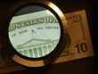 Foto: dollar and magnifier dollar and magnifier