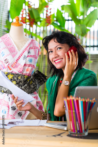 Photo: Fashion designer working at home Fashion designer working at home