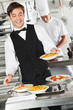 Waiter Holding Pasta Dish