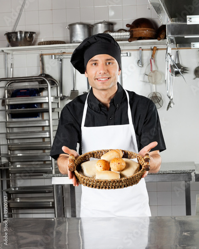 Photo: Young Chef Holding Basket Of Breads Young Chef Holding Basket Of Breads