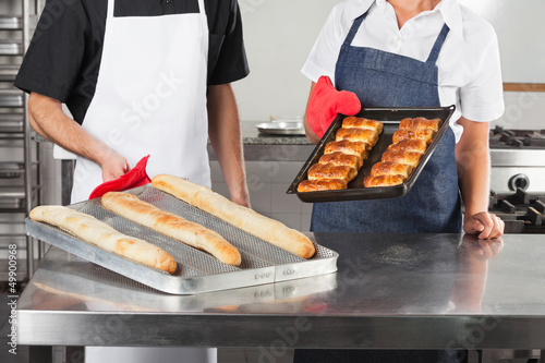 Photo: Chefs Holding Trays Of Baked Bread Chefs Holding Trays Of Baked Bread