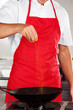 Chef Adding Turmeric Powder In Pan