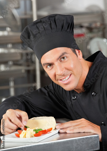 Photo: Happy Chef Garnishing Dish Happy Chef Garnishing Dish