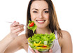 Photo: Beautiful young girl eats salad Beautiful young girl eats salad