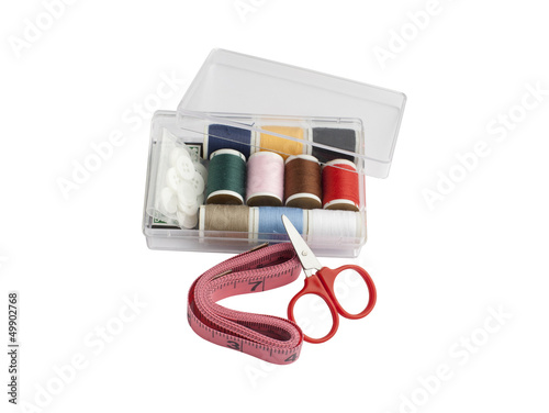 Photo: Set of sewing in the plastic box isolated on white background Set of sewing in the plastic box isolated on white background