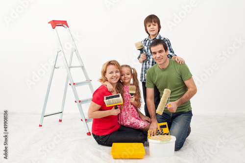 Photo: Happy people preparing to paint their home Happy people preparing to paint their home