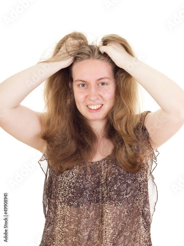 Photo: Young woman is tearing the hair Young woman is tearing the hair