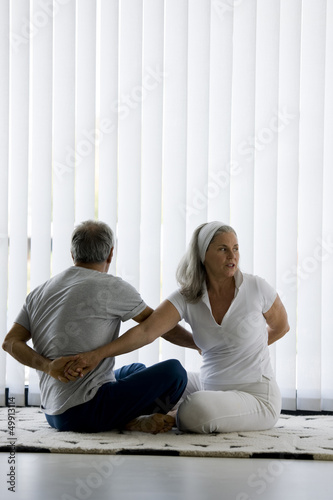 Photo: Mature couple doing yoga Mature couple doing yoga
