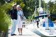 Mature couple enjoying a stroll at a marina