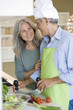 Mature couple preparing food