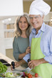 Mature couple preparing food