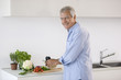 Mature man preparing food