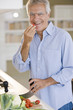Mature man preparing food